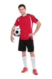 13842655 - soccer player with a ball on white background